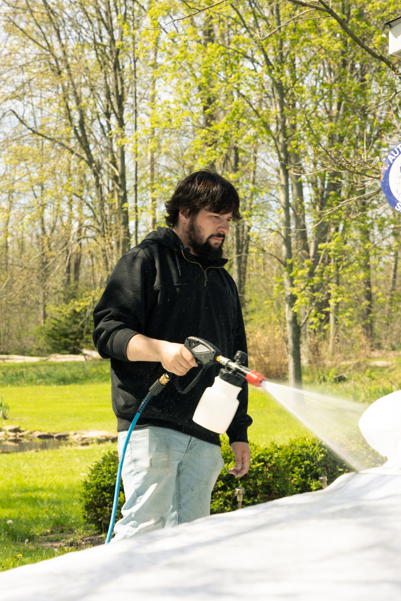 Owner applying ceramic spray coating